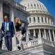 Rep. Dan Bishop (R-N.C.) talks with Rep. Marjorie Taylor Greene (R-Ga.) on the House steps at the U.S. Capitol on March 11, 2021 in Washington, D.C.